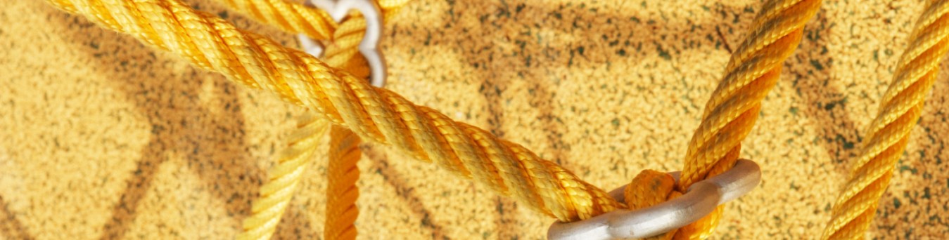 Image of yellow ropes tied on a yellow background