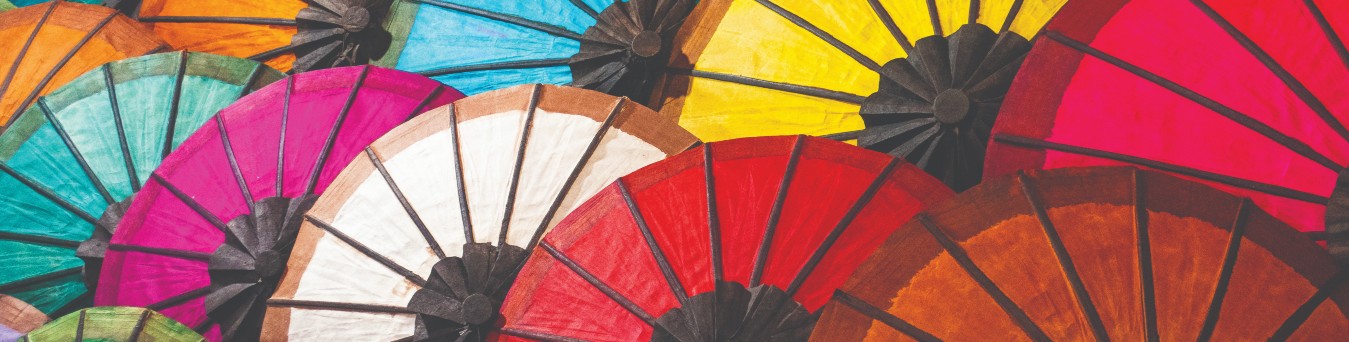 An image of many open coloured umbrellas